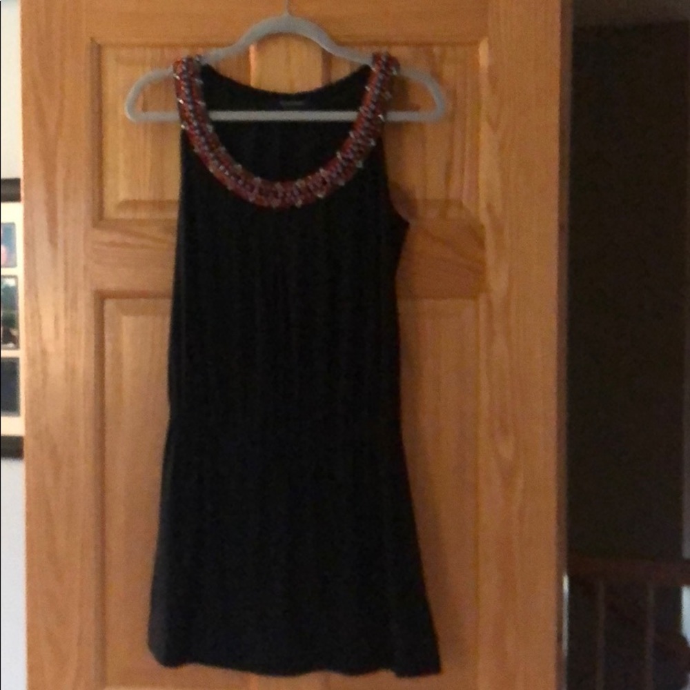 Black dress with beaded neckline.